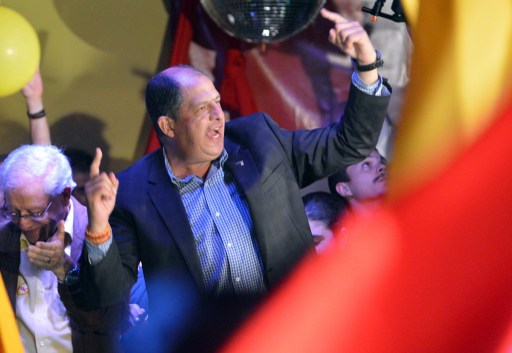 COSTA RICA, San Jose : Luis Guillermo Solis of the Accion Ciudadana (PAC) party celebrates in San Jose, on February 2, 2014. AFP PHOTO / Rodrigo ARANGUA