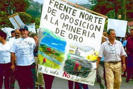 Residents protest Infinto Gold's open bit gold mine in this undated file photo.