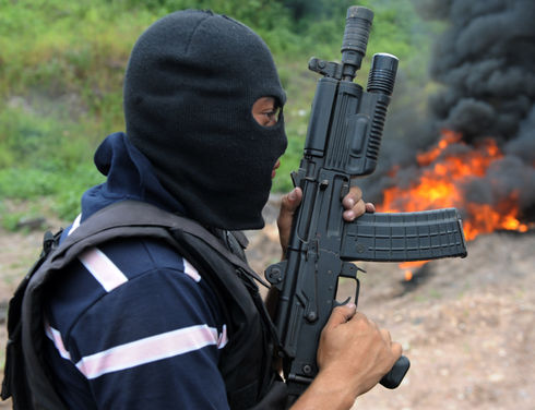 The U.S. Treasury Department thanked the Honduran government for its support after the U.S. government levied sanctions on Sept. 19 against seven individuals and five businesses linked to the Los Cachiros, a Honduran-based narco-trafficking organization. The sanctions mark a major step in bolstering Honduras’ counter-narcotics fight, which includes burning seized narcotics. (Orlando Sierra/AFP)