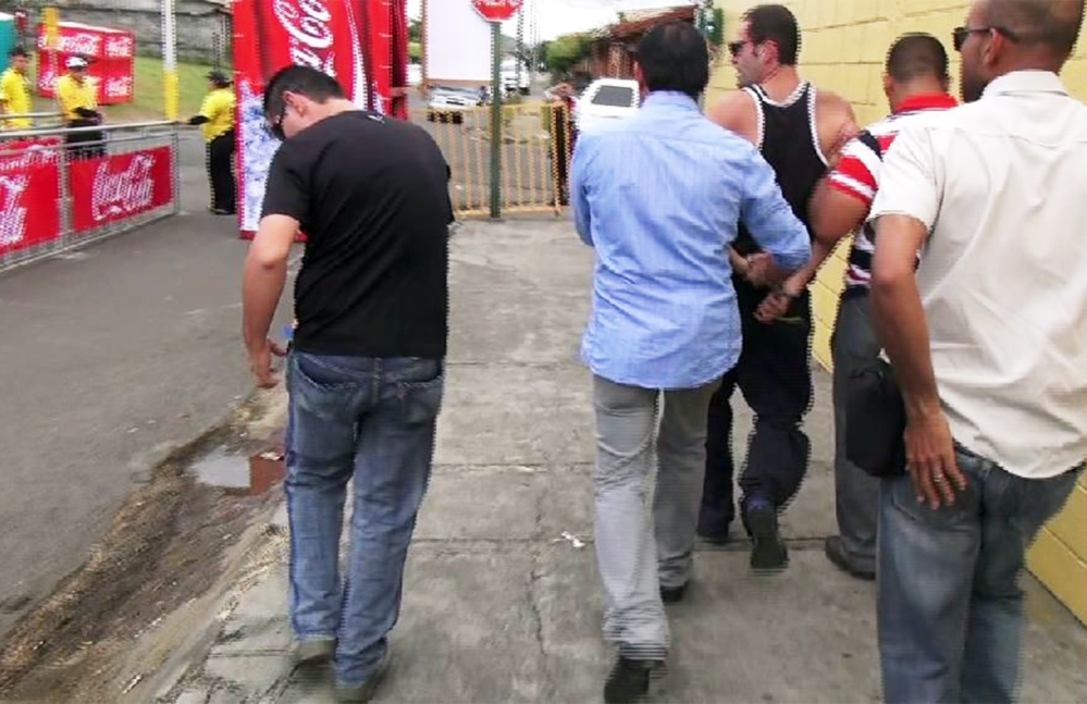 Costa Rican Immigration Police arrest U.S. citizen Luis David Cardona, 38, at the Palmares Festival in January. Cardona was deported on Wednesday. (Courtesy of Immigration Administration)