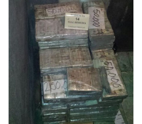 Some of the cash that was discovered in the home.  (Photo courtesy of the OIJ)