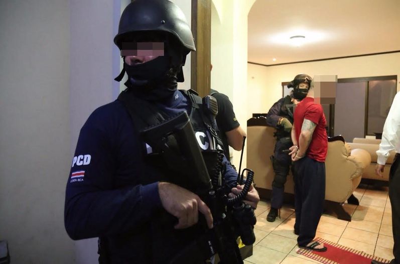 A suspected leader of a narco gang is taken into custody at his luxury home in Rivera de Belen early Tuesday morning. (MSP Photo)